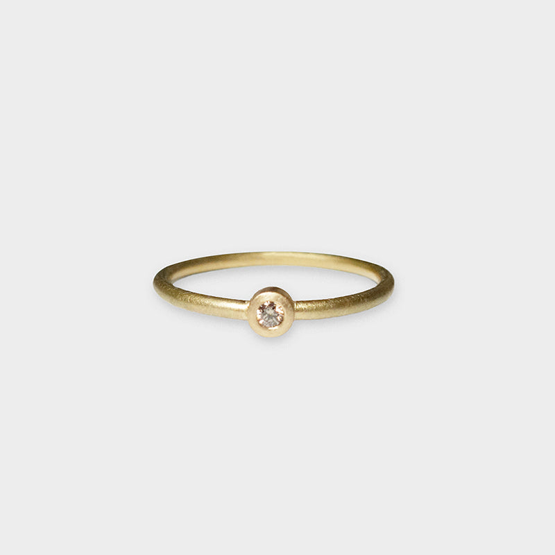 Goldring mit braunem Brillant